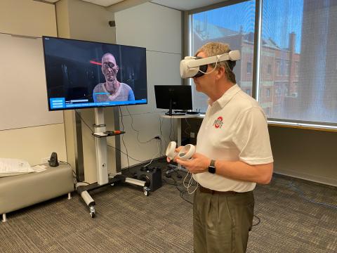 Dr. Doug Danforth tests a VR headset in the ETI's VR Zone.