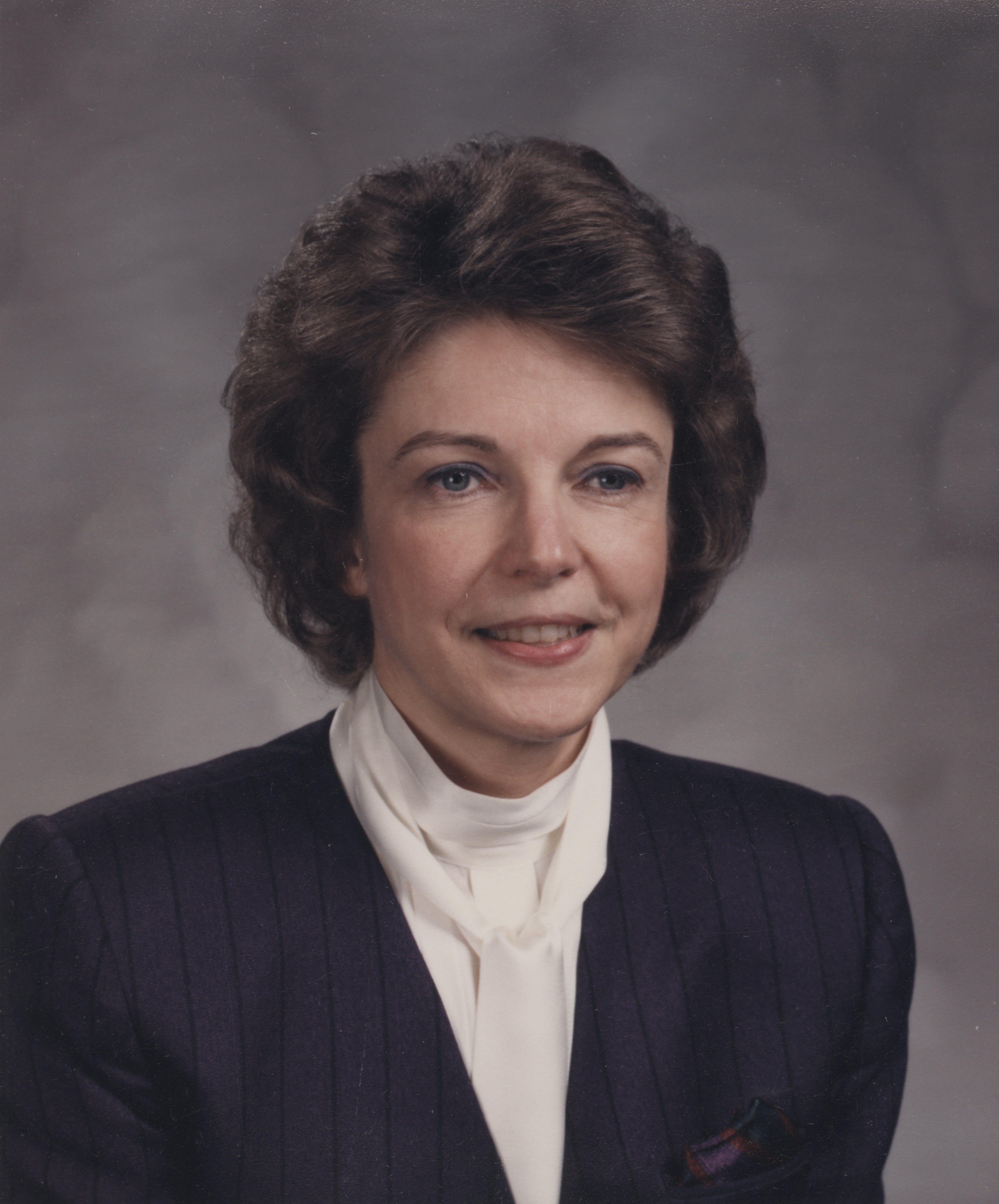 Portrait of Barbara Chapman Achter, smiling.