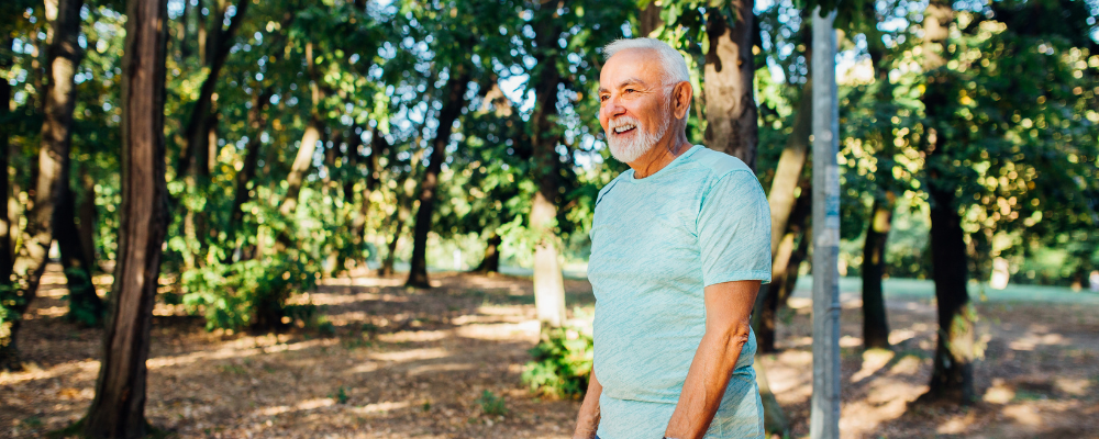 older man walking on a trail