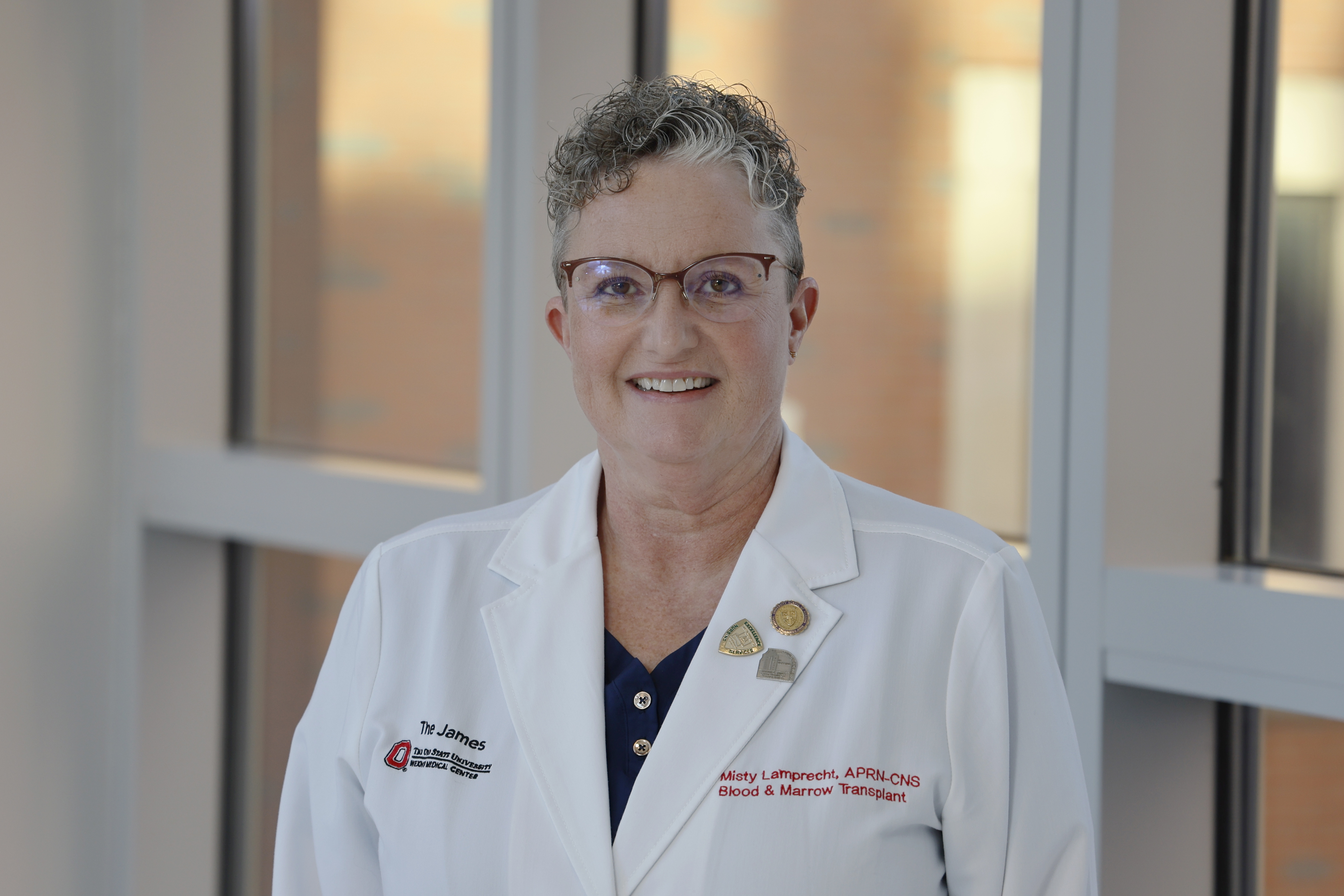 Portrait of Misty Lamprecht, smiling.