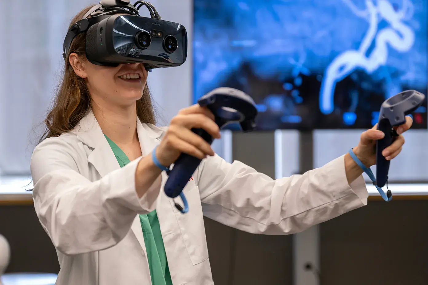 Person in lab coat using virtual reality headset.