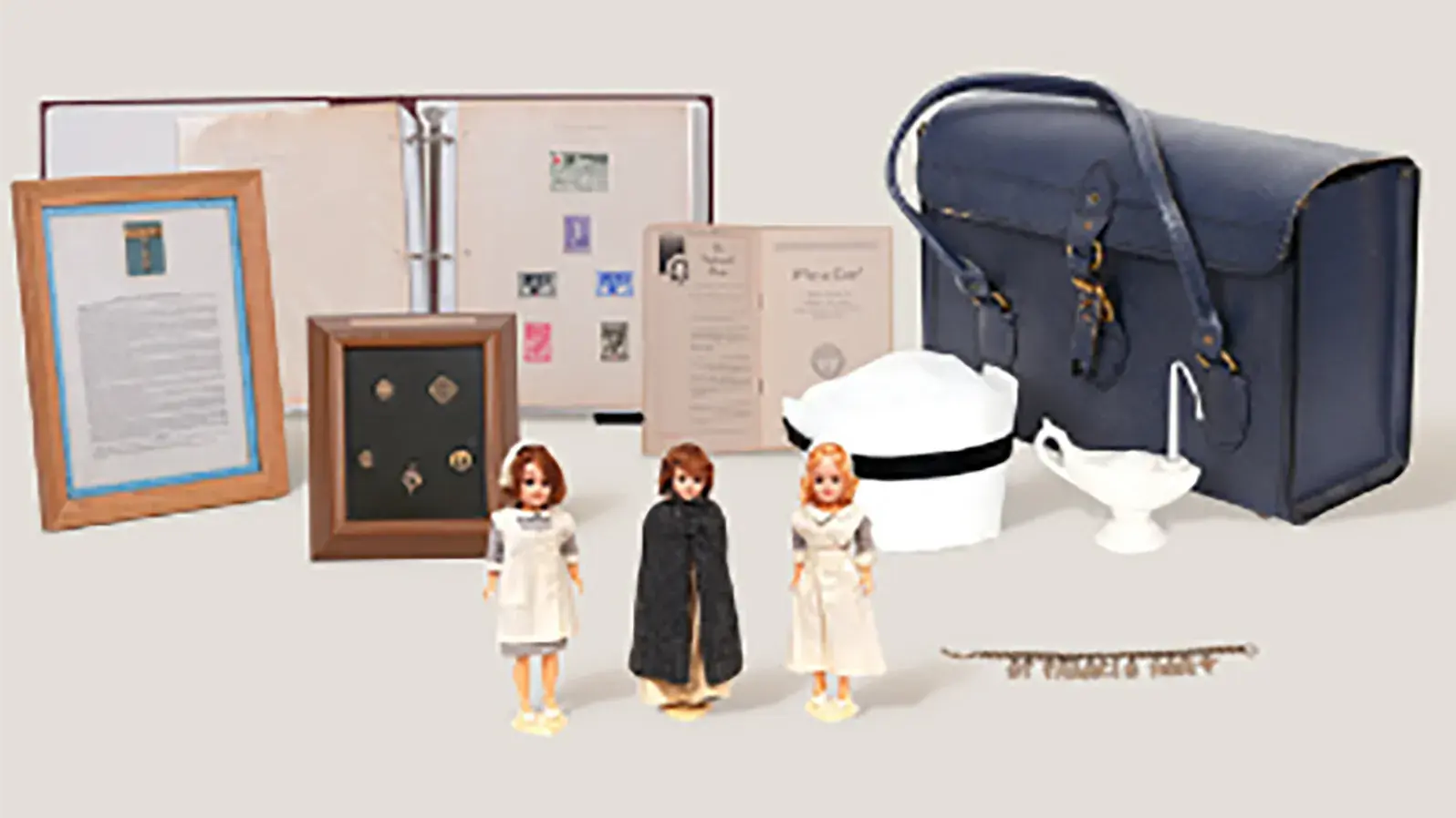 antique nurse tchotchkes including a small bag and figurines