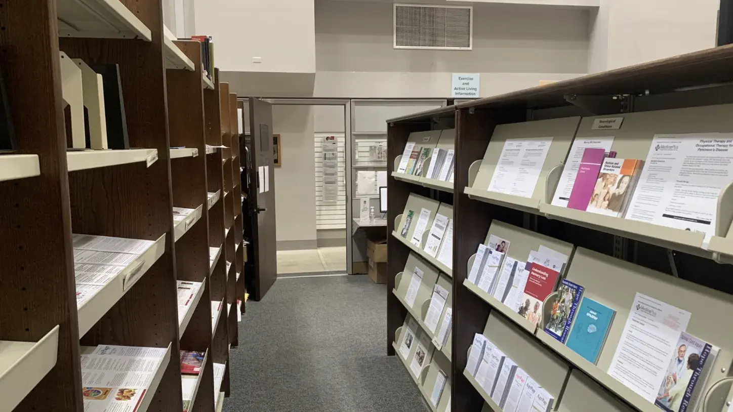 shelves containing health information pamphlets and booklets