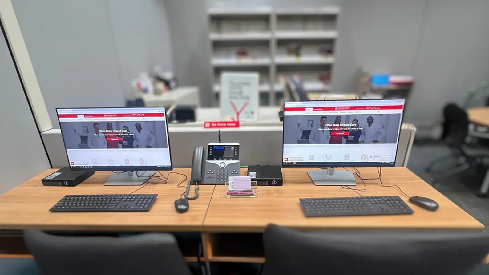 office setting with two computers on desks side by side