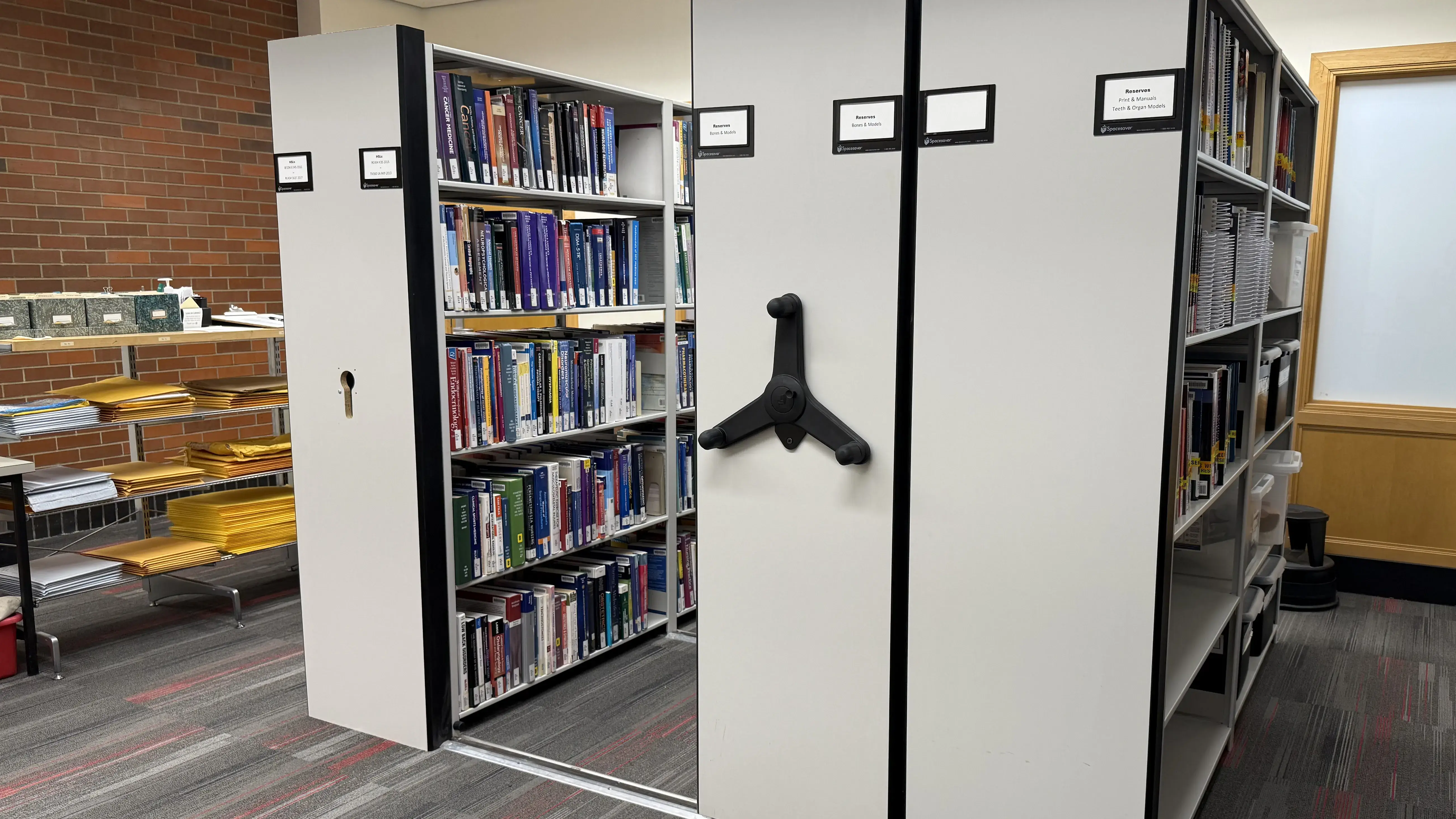 Hand cranked book stacks in a library