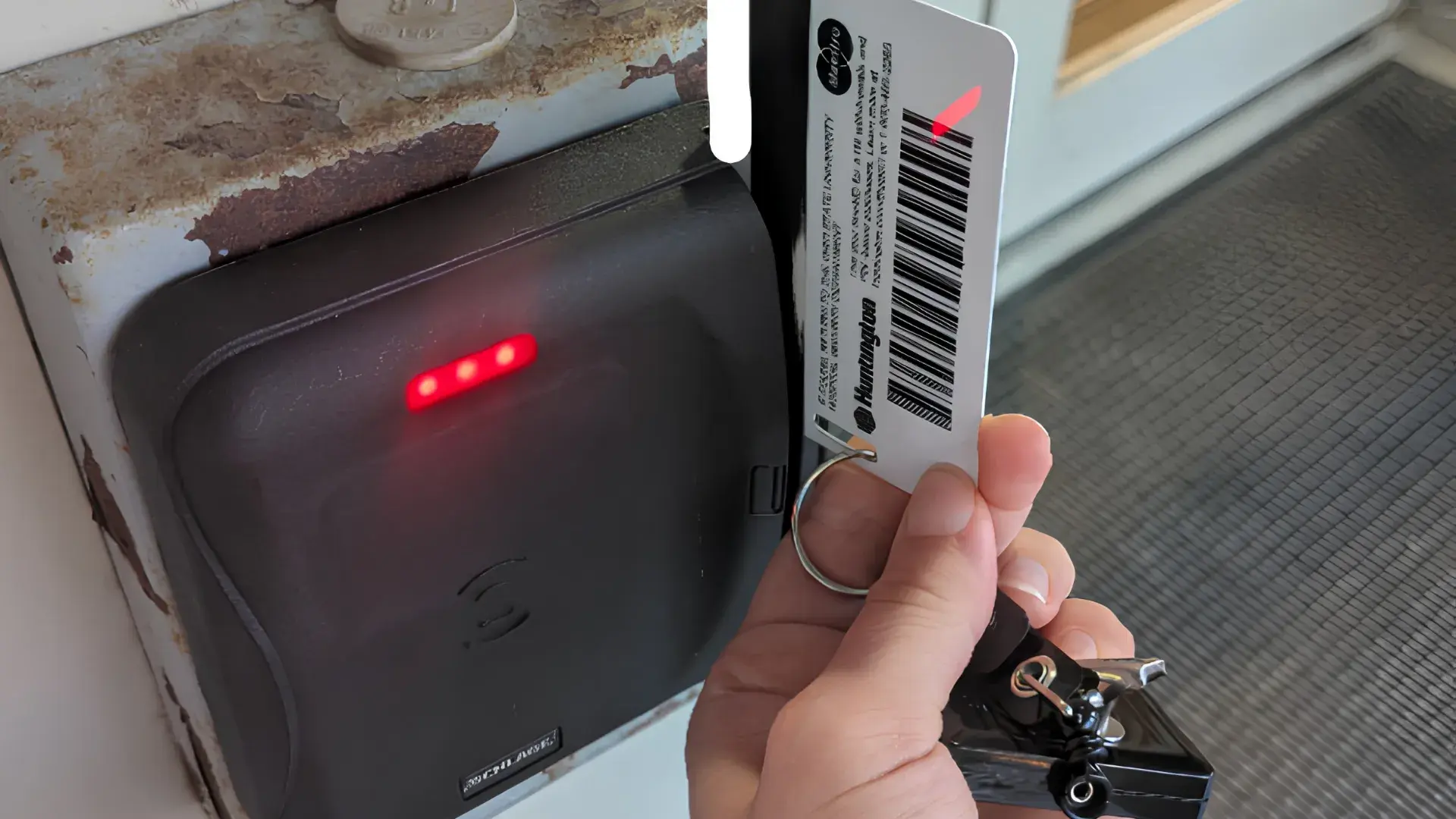 BuckID being swiped at a Lenel card reader at Prior Hall, with the magnetic stripe facing left on the new tap-enabled reader.