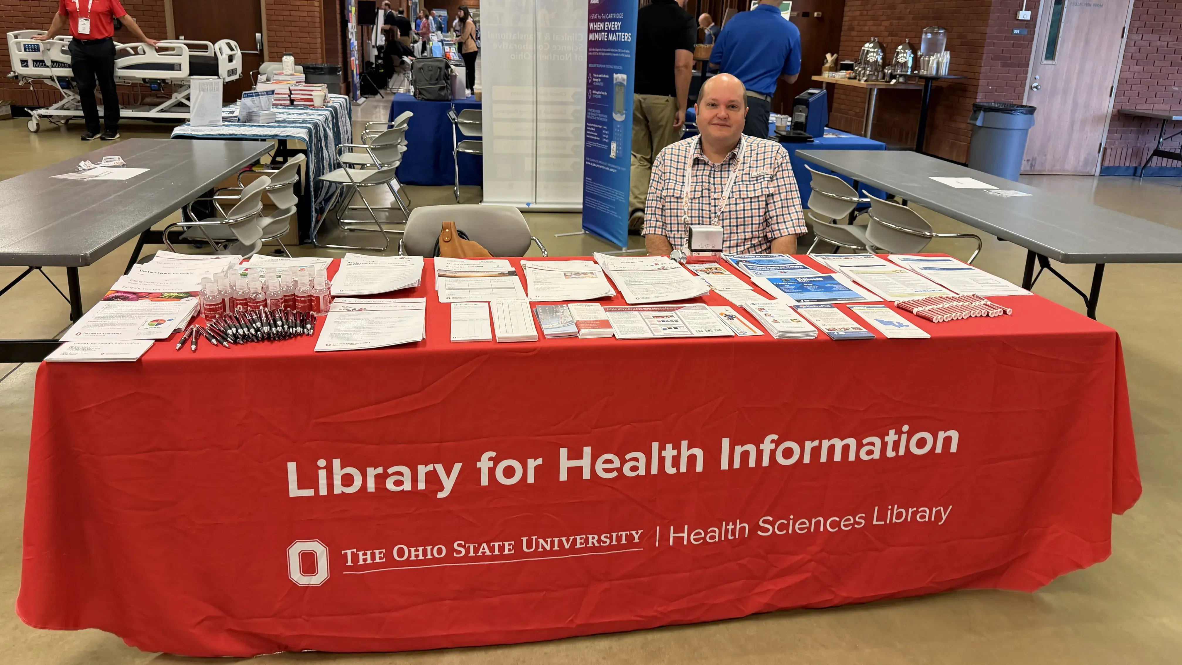 The Library for Health Information tabling at a conference.