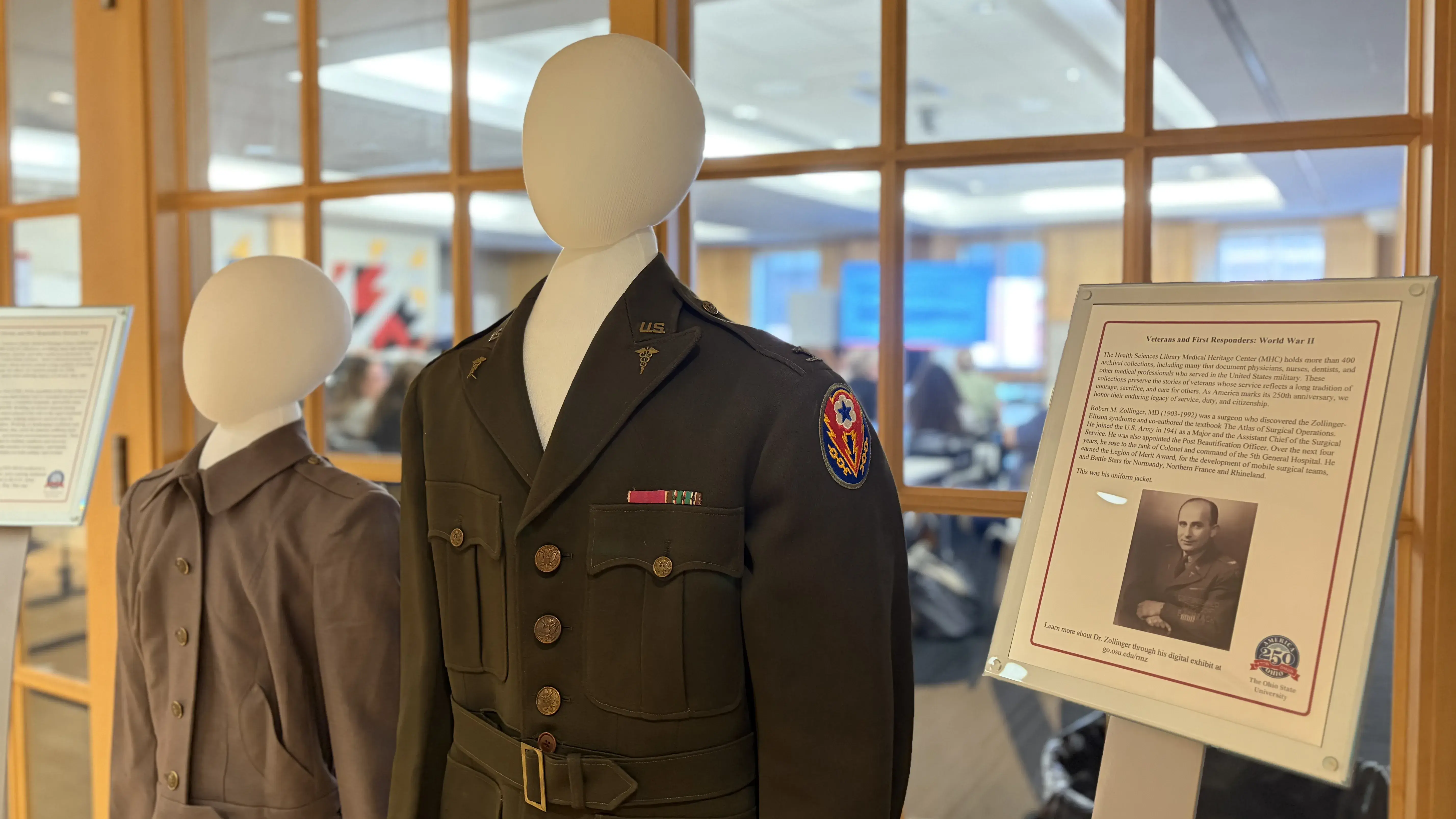 Two mannequins wearing attire from medical professionals in the military.