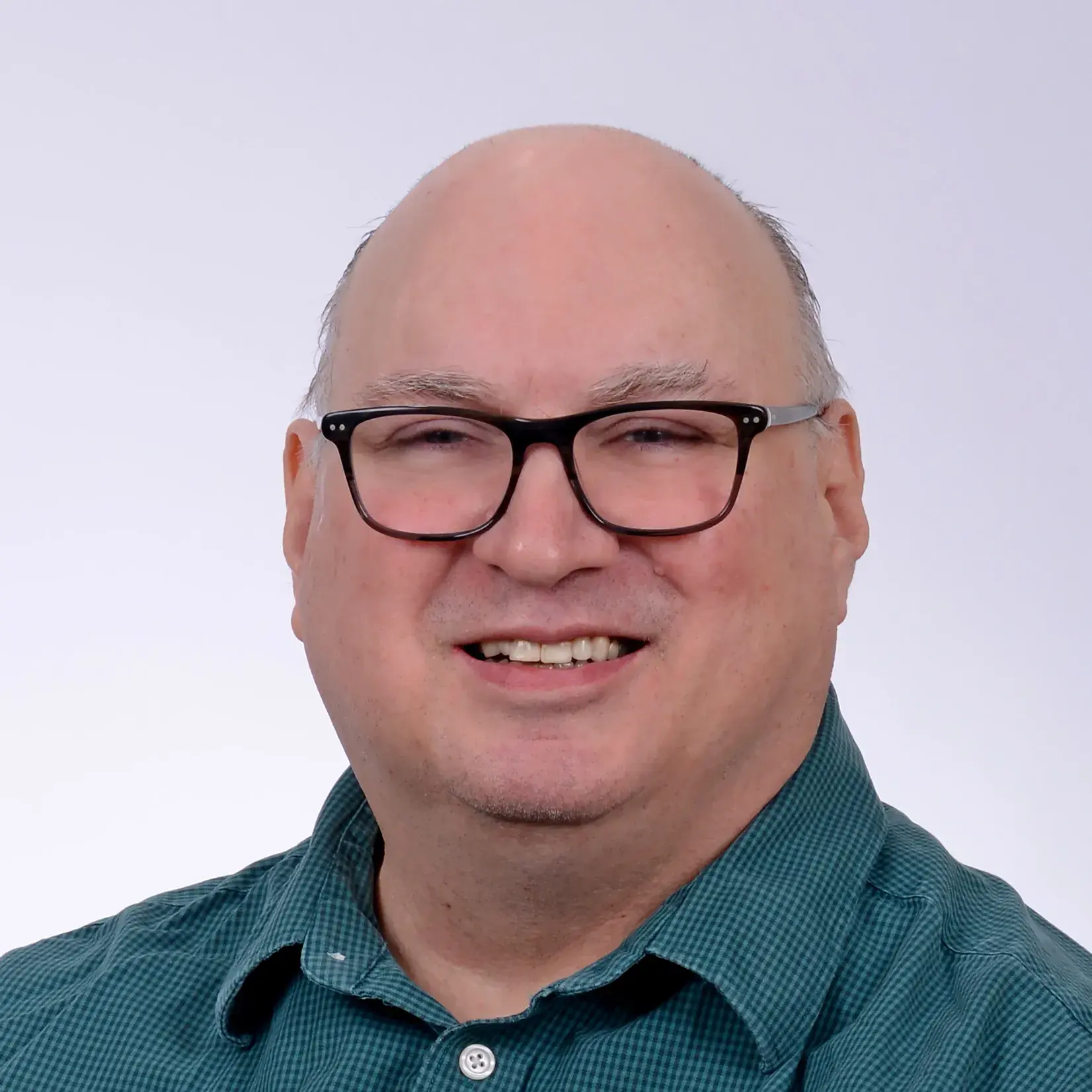 Headshot of David MacCartney, smiling.