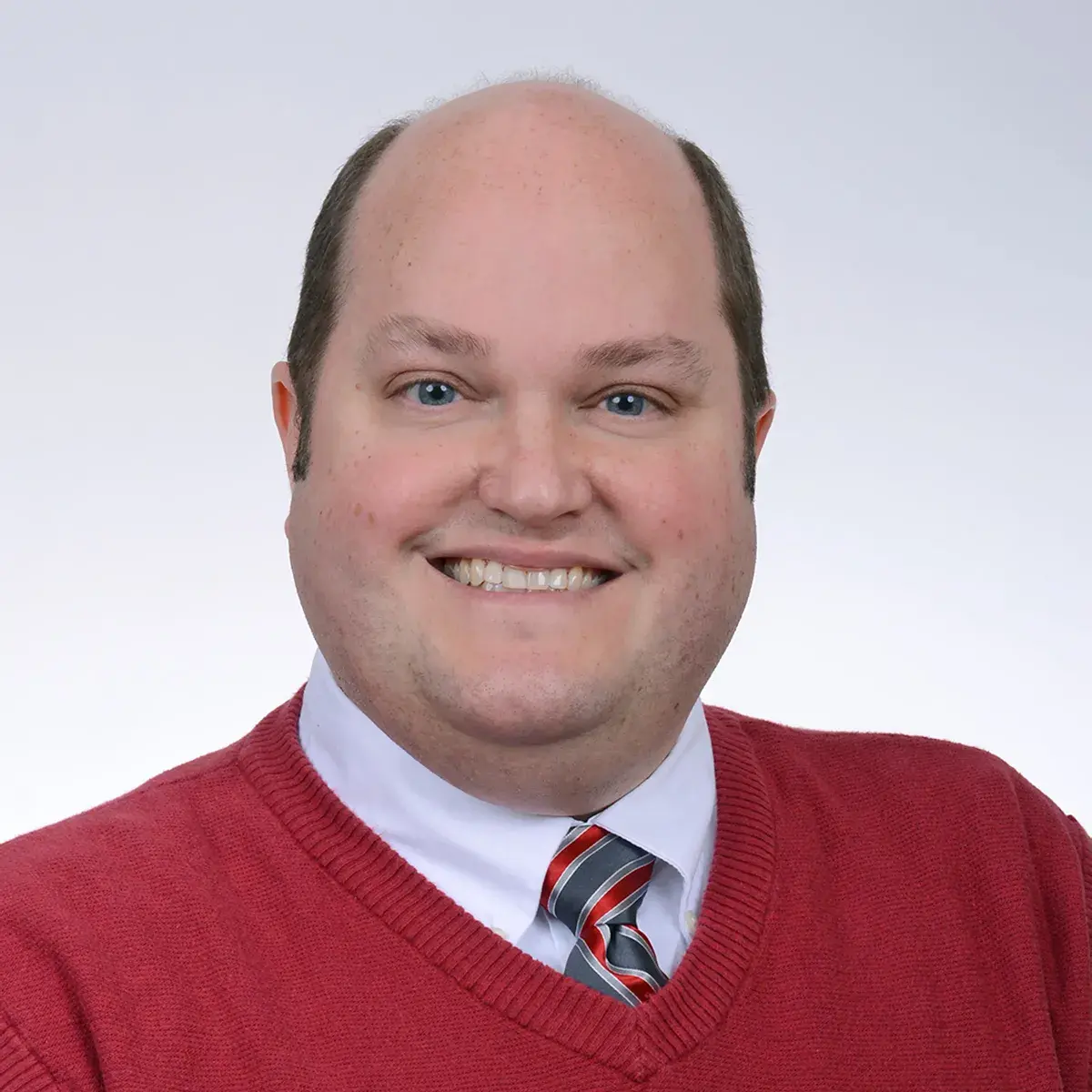 Headshot of Joe Payne, smiling.