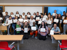 students hold up drawings of brains from Draw-a-Brain Workshop