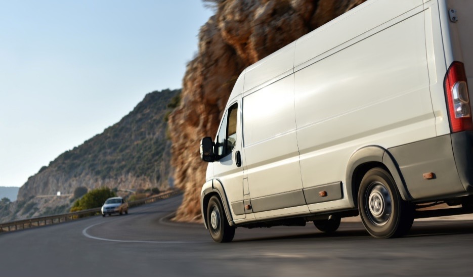 A van traveling on a scenic road.