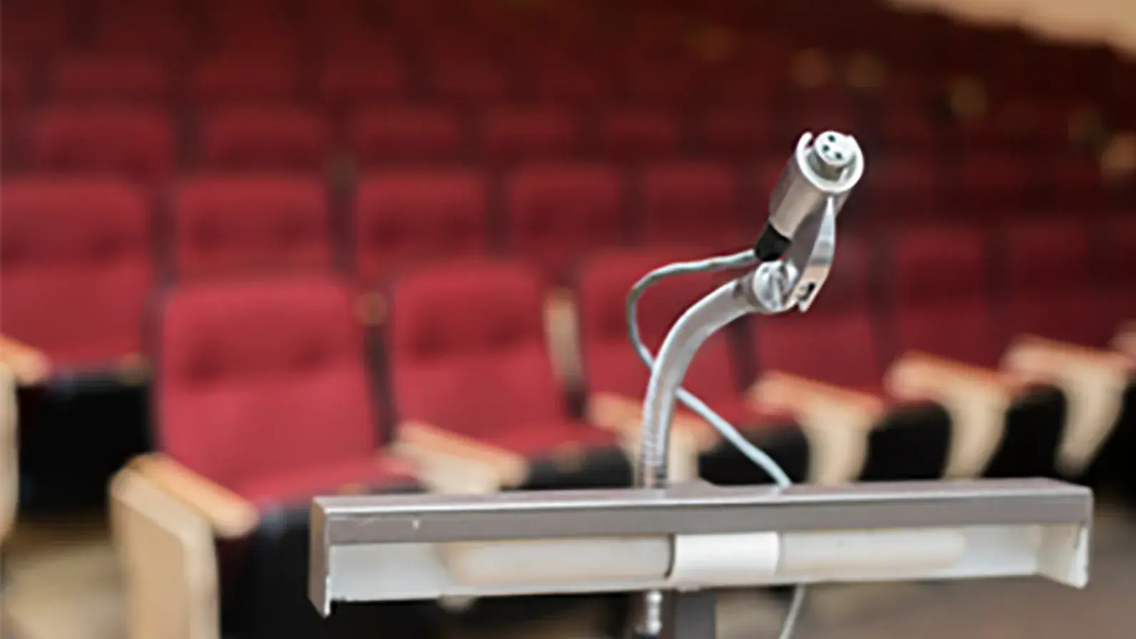a microphone in an empty auditorium