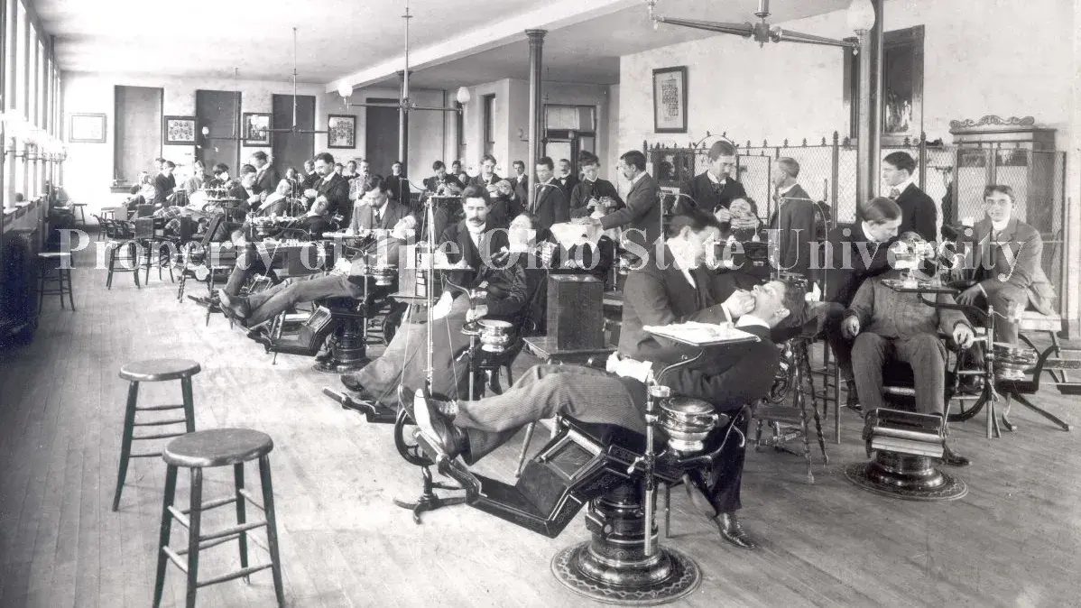 vintage view of professors and students performing dental examinations on patients