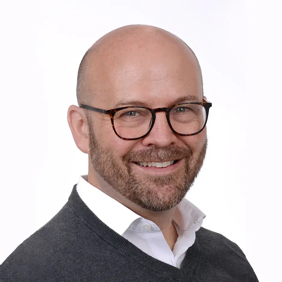 Anthony Baker, smiling.